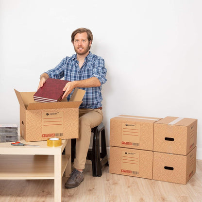 Boîte en carton ultra-résistante pour déménagement et stockage avec poignées, fabriquée en carton rigide, idéale pour le déménagement ou le stockage de livres et de vêtements, transport confortable et sûr grâce aux poignées latérales - Packer PRO