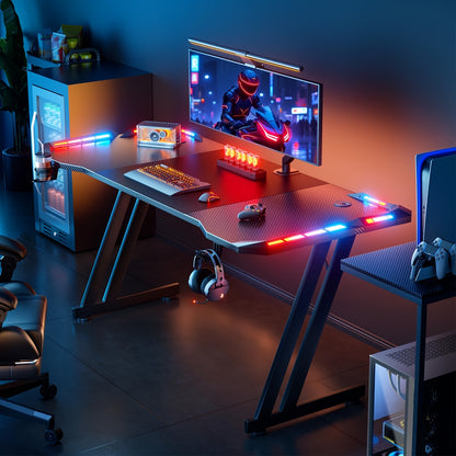 Bureau de Gaming avec Éclairage LED et Tapis de Souris, Grand Bureau Ergonomique pour Ordinateur avec Porte-Gobelet, Crochet pour Casque, Design Moderne en Fibre de Carbone pour PC Gaming & Bureau à Domicile, Noir